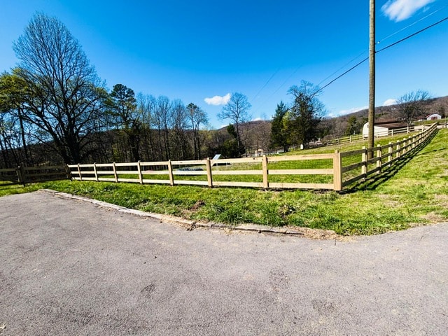 3 rail Kentucky board fence pasture corner with barn in background — East Tennessee
