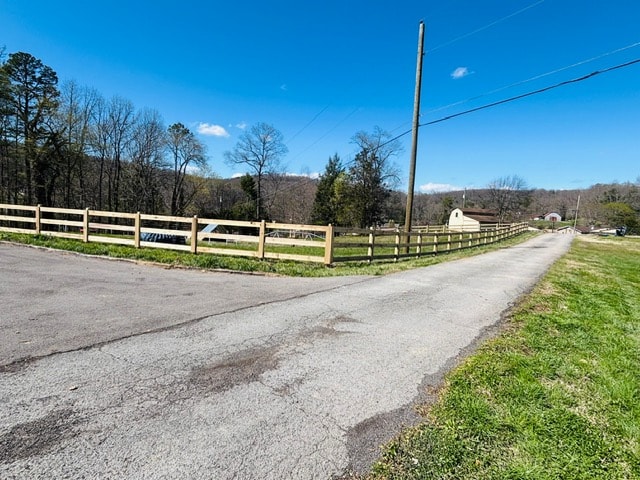 3 rail Kentucky board fence along road frontage and corner — East Tennessee farm