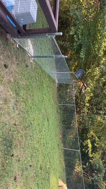 Chain link backyard dog run fence installation — East Tennessee