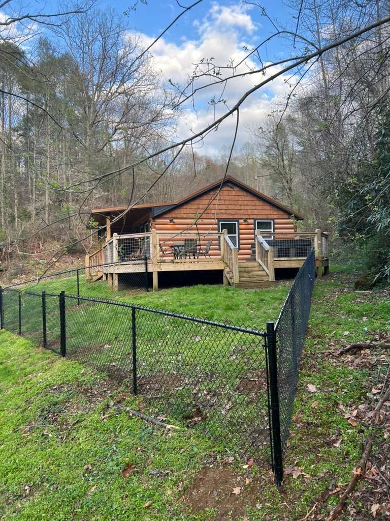 Black chain link fence at log cabin — East Tennessee