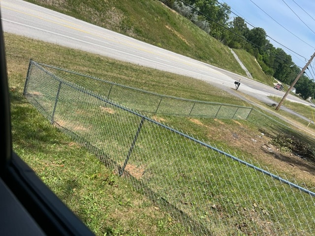 Chain link fence along road frontage — East Tennessee