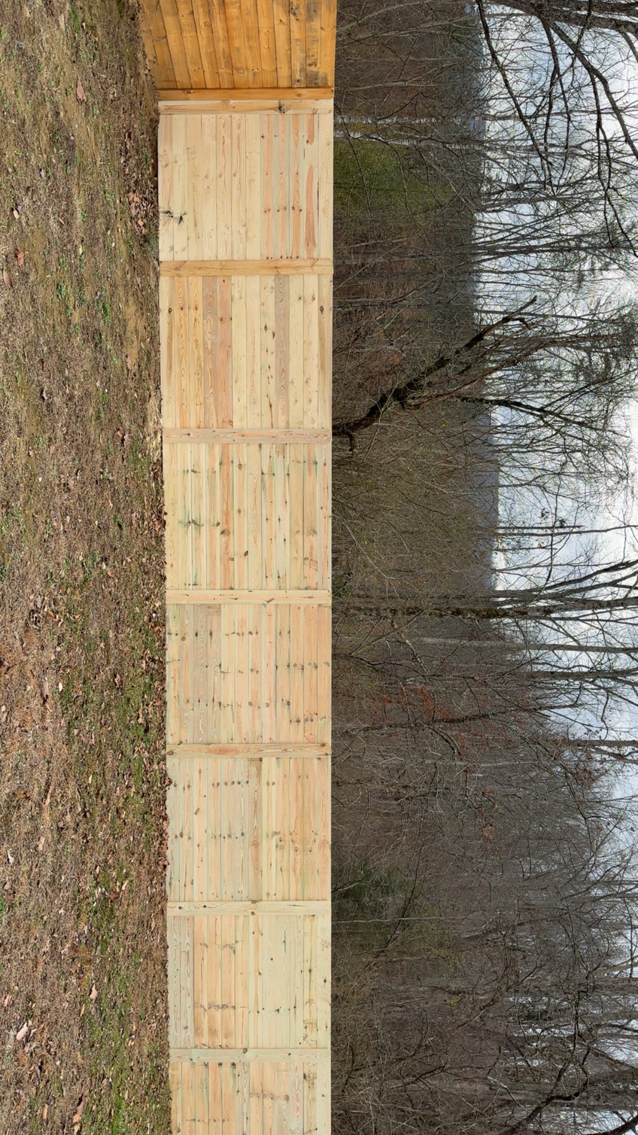 Horizontal privacy fence panels wooded setting East Tennessee