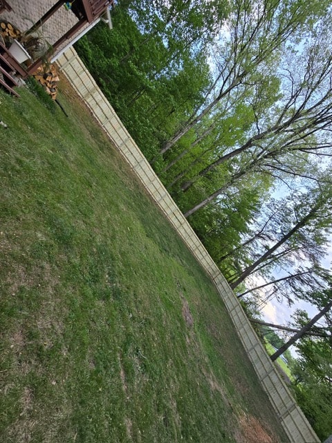 6 foot wood privacy fence along backyard tree line — East Tennessee residential