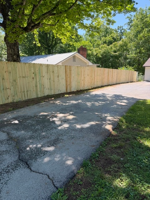 6 foot wood privacy fence along driveway — East Tennessee