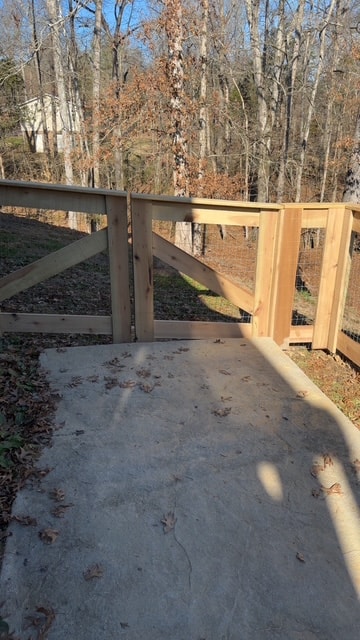 Cedar wood gate and fence installation in wooded backyard — Knoxville, TN fence contractor
